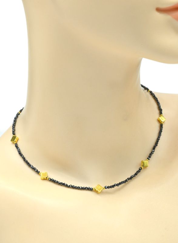 Choker on the neck made of cubic zirconia ball 2mm with an insert of hematite clover 6*6mm color pyrite, 38cm