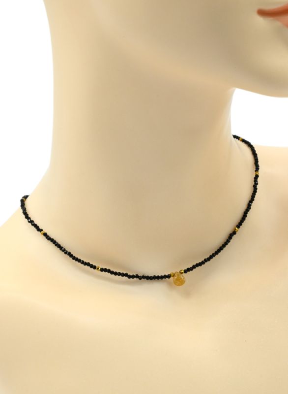 Choker on the neck made of black spinel with a pendant made of amber, honey color, 39cm